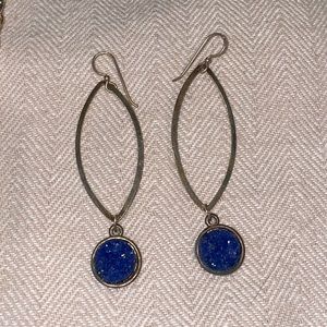 Gold drop earrings with blue rough stone.